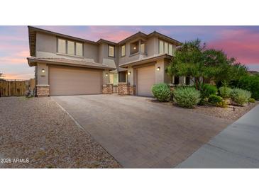 Charming two-story home featuring a spacious driveway and two-car garage, perfect for families at 9342 W White Feather Ln, Peoria, AZ 85383