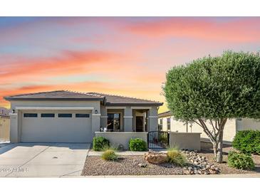 Charming single-story home with a well-maintained front yard and inviting entrance; attached garage and desert landscaping at 17520 W Fairview St, Goodyear, AZ 85338