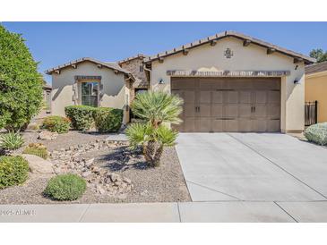 Charming single-story home featuring desert landscaping and a two-car garage at 1776 E Laddoos Ave, Queen Creek, AZ 85140