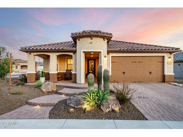 Charming home featuring desert landscaping, a clay tile roof, and a welcoming entrance at 27021 W Kerry Ln, Buckeye, AZ 85396