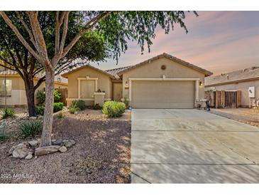 Charming single-story home featuring a two-car garage and low-maintenance desert landscaping at 35397 N Shorthorn Trl, San Tan Valley, AZ 85143