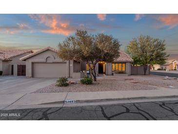 Charming single-story home featuring desert landscaping, a two-car garage, and a cozy front patio at 3842 W Ironwood Dr, Chandler, AZ 85226