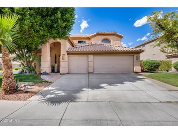 Charming home with a well-maintained front yard, large shade trees, and a spacious three-car garage at 514 E Yvonne Ln, Tempe, AZ 85284