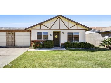 Charming single-Gathering home with well-maintained lawn and tidy landscaping at 9635 W Ironwood Dr # B, Peoria, AZ 85345