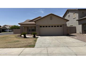 Charming single-story home featuring a tile roof and a spacious two-car garage at 12505 W Adams St, Avondale, AZ 85323