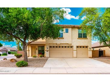 Charming two-story home with a desert landscaped yard and a spacious two-car garage at 1036 E Magnum Rd, San Tan Valley, AZ 85140