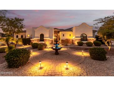 Stunning home featuring desert landscaping, a brick walkway, and a fountain at 18226 W Marshall Ct, Litchfield Park, AZ 85340