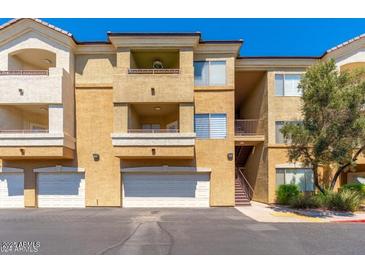 Inviting condo featuring balconies, garage, and convenient stair access to upper units at 18416 N Cave Creek Rd # 3034, Phoenix, AZ 85032