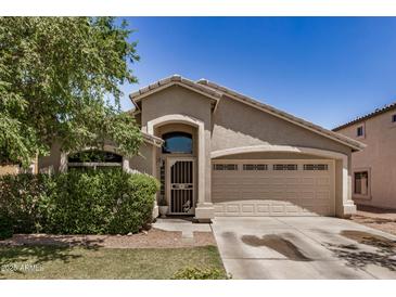 Charming single-story home featuring a well-maintained front yard and two-car garage at 2727 S 160Th Ln, Goodyear, AZ 85338