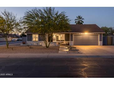 Charming single-story home with a well-maintained yard and two-car garage, perfect for suburban living at 300 E Moore Ave, Gilbert, AZ 85234