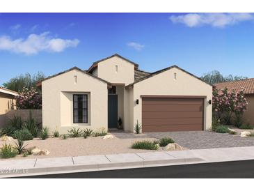 Charming single-story home with a stucco facade, desert landscaping, and a two-car garage at 537 E Aurora Dr, San Tan Valley, AZ 85140