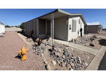 Cozy home featuring desert landscaping with rocks and cacti for a tranquil outdoor space at 11596 W Sierra Dawn Blvd # 33, Surprise, AZ 85378