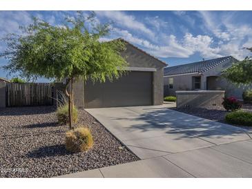 Charming home exterior with neutral paint, two-car garage and low-maintenance landscaping at 3661 E Appaloosa Dr, San Tan Valley, AZ 85140