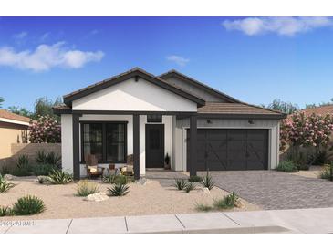 Charming single-story home with neutral stucco, black trim, and desert landscaping for a modern look at 491 E Aurora Dr, San Tan Valley, AZ 85140