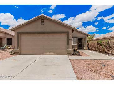 Charming single-story home with a two-car garage and low-maintenance desert landscaping at 12034 W Aster Dr, El Mirage, AZ 85335