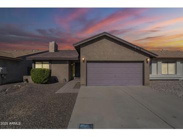Charming single-story home featuring a two-car garage, desert landscaping, and a welcoming entrance at 14234 N 26Th Ln, Phoenix, AZ 85023