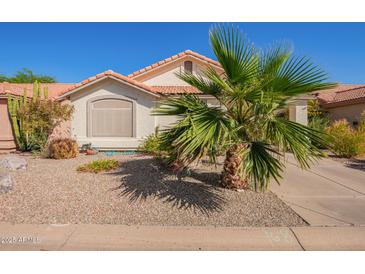Charming home featuring a desert landscape, a red tiled roof, and a mature palm tree in the front yard at 1803 E Palm Beach Dr, Chandler, AZ 85249