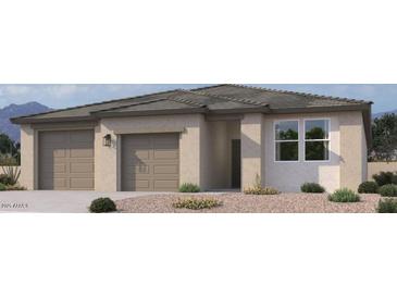 Charming single-story home featuring a neutral color palette, a two-car garage, and desert landscaping at 47198 W Mellen Ln, Maricopa, AZ 85139