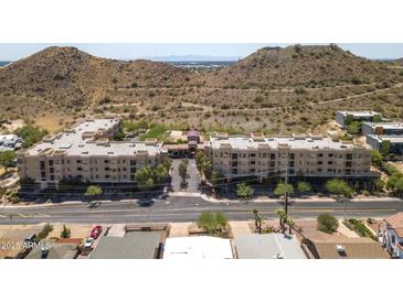 Beautiful condo complex with mountain views and well-maintained landscaping, and secure covered parking at 9820 N Central Ave # 324, Phoenix, AZ 85020