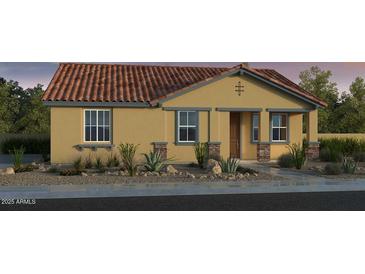 Charming single-story home with desert landscaping, a tile roof, and an inviting facade at 9972 W Piccadilly Rd, Avondale, AZ 85392
