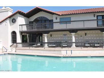 Enjoy the community pool with comfortable lounge chairs on the covered patio at 11011 N 92Nd St # 1096, Scottsdale, AZ 85260