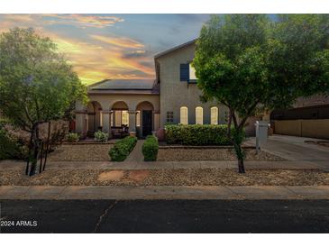 Charming single-Gathering home featuring a well-manicured front yard and tasteful landscaping at 11785 N 143Rd Dr, Surprise, AZ 85379