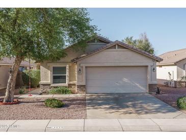 Charming single-story home featuring desert landscaping and a two-car garage, with easy street access at 13034 W Cheery Lynn Rd, Avondale, AZ 85392