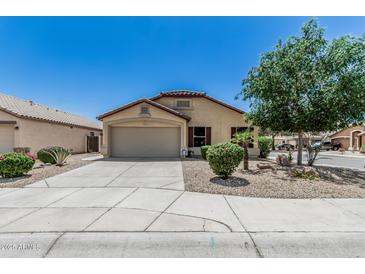 Charming single-story home showcasing a low maintenance front yard and an attached two-car garage at 16675 W Taylor St, Goodyear, AZ 85338