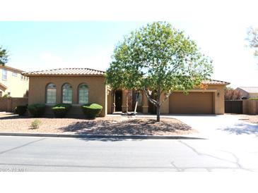 Charming single-story home with desert landscaping and a tile roof, featuring a well-manicured front yard at 20243 E Poco Calle --, Queen Creek, AZ 85142