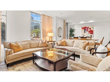 Bright and airy living room with comfortable seating and views of the city at 2402 E Esplanade Ln # 204, Phoenix, AZ 85016