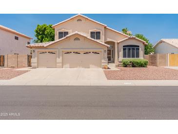 Charming two-story home with a three-car garage and well-maintained landscaping at 4746 W Taro Dr, Glendale, AZ 85308