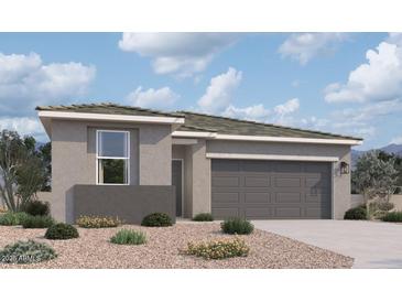 Beautiful single-story home features a two-car garage and professionally landscaped front yard at 47719 W Moeller Rd, Maricopa, AZ 85139