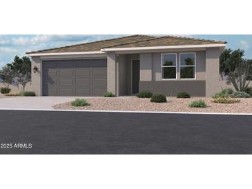 Charming single-story home with a two-car garage and low-maintenance desert landscaping at 15781 W Beryl Ave, Waddell, AZ 85355