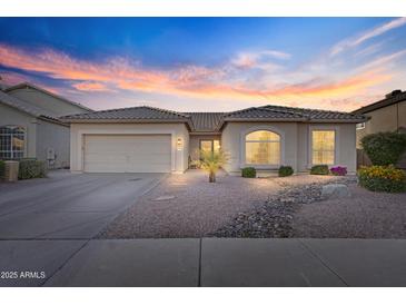 Charming single-story home with a two-car garage and lovely desert landscaping at 418 W Sagebrush St, Gilbert, AZ 85233