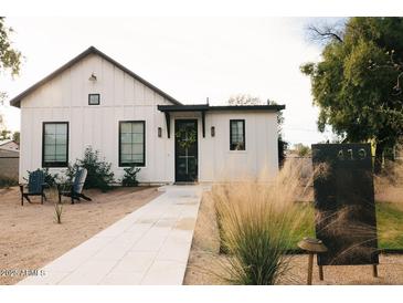 Charming home featuring a modern farmhouse design, landscaped front yard, and welcoming entrance at 419 W 11Th St, Tempe, AZ 85281