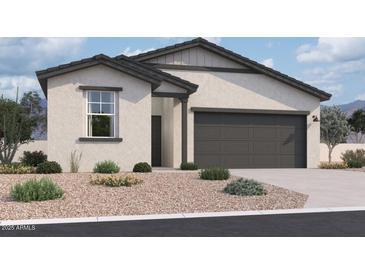Beautiful single story home featuring a two-car garage and neutral colored stone landscaping at 47720 W Kenner Dr, Maricopa, AZ 85139