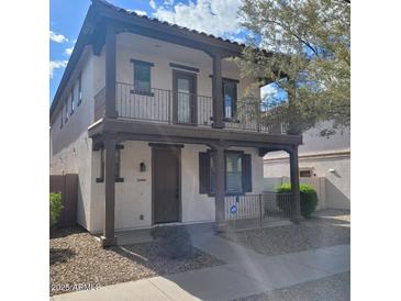 Charming two-story home with a beautiful balcony and well-maintained front yard at 6908 S 8Th Dr, Phoenix, AZ 85041