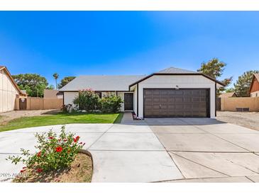Charming single-story home featuring a well-manicured lawn and attached two car garage at 7231 W Sierra Vista Dr, Glendale, AZ 85303