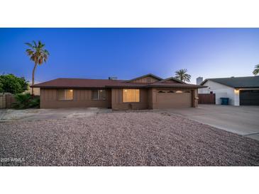 Charming single-level home featuring a low maintenance front yard and a two car garage at 2337 E Riviera Dr, Tempe, AZ 85282