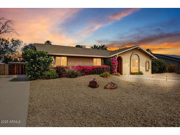 Charming single-story home featuring mature landscaping, desert landscaping, and a well-maintained exterior at 2846 E Lupine Ave, Phoenix, AZ 85028