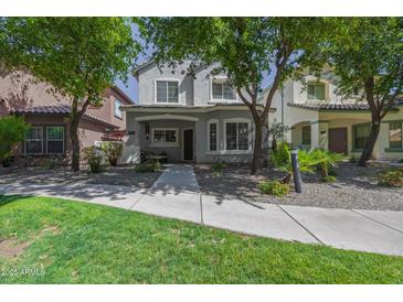 Charming two-story home with well-maintained landscaping and inviting curb appeal at 3065 E Tamarisk St, Gilbert, AZ 85296