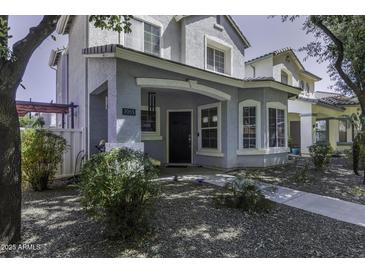 Inviting covered front porch with stylish architectural details and a welcoming entrance at 3065 E Tamarisk St, Gilbert, AZ 85296