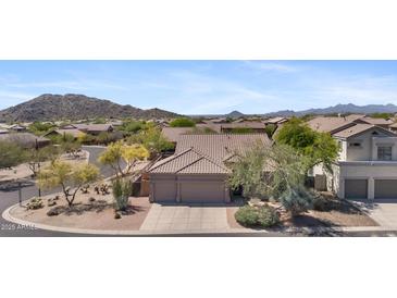 Stunning home exterior with mountain views and three-car garage in a desirable neighborhood at 3544 N Paseo Del Sol --, Mesa, AZ 85207
