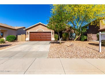Charming single-story home with desert landscaping and a well-maintained front yard at 43303 N 44Th Ave, New River, AZ 85087
