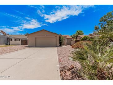 Charming single-story home with a two-car garage and well-maintained landscaping at 5237 W Mountain View Rd, Glendale, AZ 85302