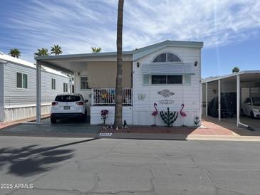 Charming single-story home featuring a carport and vibrant landscaping at 1001 S Prospector Dr # 1001, Apache Junction, AZ 85119