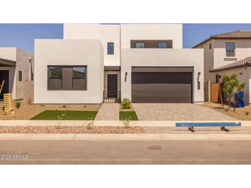 Modern two-story home with a well-maintained front yard and a two-car garage at 10236 E Utah Ave, Mesa, AZ 85212