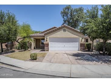 Charming single-story home with a two-car garage and well-maintained front yard at 17953 N Lettere Cir, Maricopa, AZ 85138