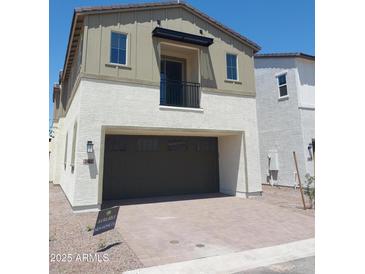 Charming two-story home featuring a two-car garage and balcony, perfect for modern living at 2463 W Rowel Rd, Phoenix, AZ 85085
