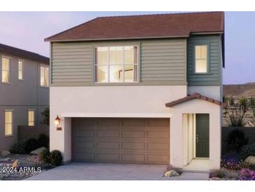Charming two-story home featuring a two-car garage and a welcoming entrance at 2486 W Rowel Rd, Phoenix, AZ 85085